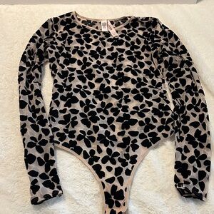 Victoria Secret one piece body suit. Mesh material with velvet pattern. Size S.